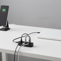 Magnetic cable organizer on a clean modern white desk with neatly organized cables